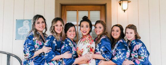 Hollow Hill Event Center Wedding and Event Venue, Weatherford, Texas. Bride and bridesmaids in robes smiling on front porch