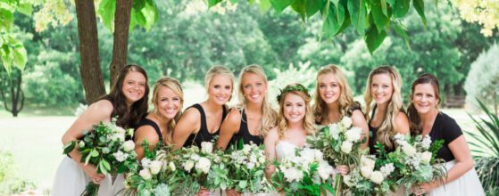 Hollow Hill Event Center Wedding and Event Venue, Weatherford, Texas. Bride with her bridesmaids under canopy of trees